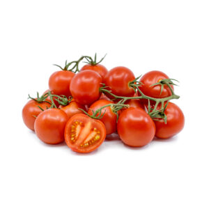 A cluster of vibrant, deep red Campari tomatoes on the vine, isolated on a white background, with one tomato sliced in half in the foreground to show its juicy, seeded interior.