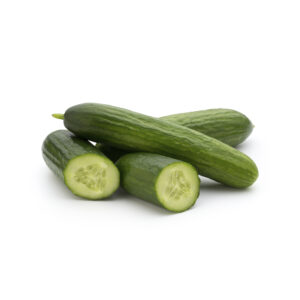 A small pile of fresh, dark green Persian cucumbers on a white background, with one cucumber sliced in half to show its crisp, seedless interior and thin skin.