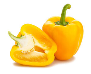 bright yellow bell peppers with glossy smooth skin and blocky four-lobed shape on a white background.
