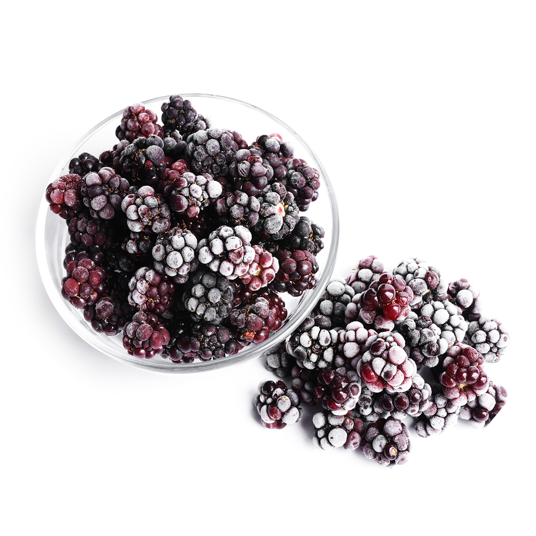A pile of dark purple Frozen Blackberries with frosted IQF surface and segmented berry shape on a white background.